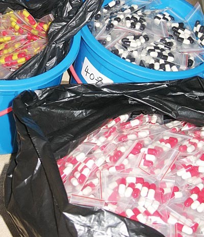 A cache of fake drugs found in a small workshop in HCMC (Photo: SGGP)