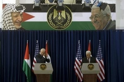 US Vice President Joe Biden and Palestinian president Mahmud Abbas read a statement to the press following their meeting in the West Bank city of Ramallah