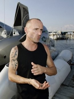 In this 2006 picture captain Pete Bethune is pictured standing next to the alternative-fueled high-speed powerboat Earthrace, later to be renamed the Ady Gil, in Fort Lauderdale, Florida