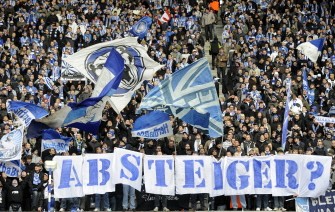 Hertha BSC fans cheer with a banner reading "Relegation?" ahead of the Bundesliga football match Hertha BSC vs FC Nuremberg on March 13, 2010 in Berlin. AFP PHOTO