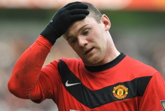 Wayne Rooney reacts during the English Premier League football match against Fulham at Old Trafford in Manchester on March 14, 2010. AFP PHOTO