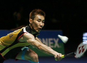 Lee Chong Wei plays against Kenichi Tago of Japan in the final of the men's singles during the All England Open Badminton Championships in Birmingham on March 14, 2010. AFP photo