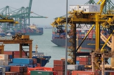 (AFP file) Cargo ships are anchored at a container port in Singapore.