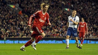Fernando Torres (L) celebrates after scoring against Portsmouth during their English Premier League football match at Anfield in Liverpool on March 15, 2010. AFP PHOTO