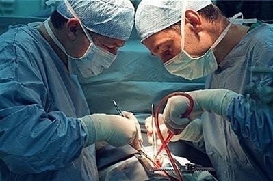 Doctors perform heart surgery. Women die more often than men from heart disease because they are not systematically given the same treatment and tests, according to a French study unveiled Tuesday.