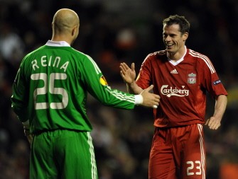 Liverpool's English defender Jamie Carragher (R) celebrates with Spanish goalkeeper Pepe Reina after their UEFA Europa League football match against Lille at Anfield in Liverpool on March 18, 2010. AFP photo