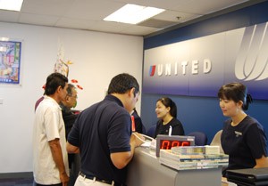 Passengers at the United Airlines booking office in Ho Chi Minh City