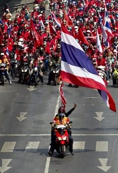 Antii-government demonstrators gather at an intersection in downtown Bangkok, Thailand, Saturday March 20, 2010.