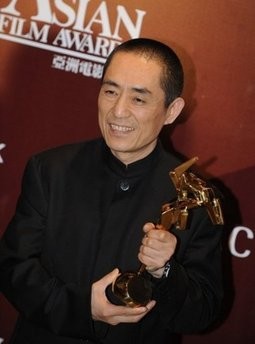 China's Zhang Yimou is pictured with his Outstanding Contribution to Asian Cinema award at the 4th annual Asian Film Awards presentation ceremony at the Hong Kong Convention and Exhibition Centre, on March 22.