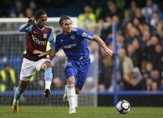 Lampard (R) vies with Aston Villa's Nathan Delfouneso (L) during the English Premier League football on March 27, 2010. AFP PHOTO