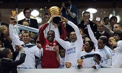 Marseille's players celebrate with their trophies after winning the League Cup final at the Stade-de-France stadium in Saint-Denis, outside Paris. AFP photo