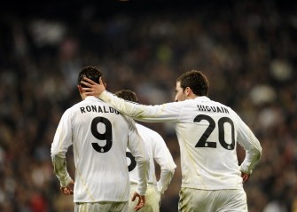 Real Madrid's Cristiano Ronaldo (L) speaks with Gonzalo Higuain (R) during a Spanish league football match against Atletico de Madrid on March 28, 2010 in Madrid. Real Madrid won 3-2. AFP PHOTO