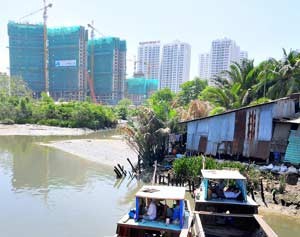 High-rises are increasingly being built in the city to replace slums (Photo: SGGP)