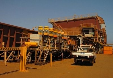 A train carrying iron ore is emptied for loading onto bulk carriers at Rio Tinto's port facilities near Dampier in Western Australia.