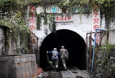 File photo shows miners entering a coal mine in China