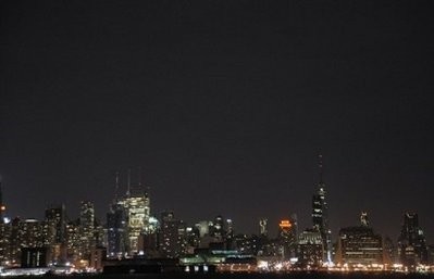 General view of the New York City skyline as the Empire State Building and Chrysler Building turn off their tower lights