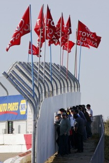 Fans watch from behind a fence during qualifying for the Toyota NAPA Bonus Challenge on March 27, 2010 in Roseville, California. AFP photo
