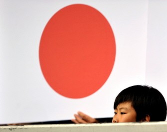 A young Japanesse fan is watching a friendly football match between England and Japan in Graz on May 30, 2010. AFP PHOTO