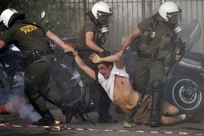 Police drag a protestor during a pro-Palestine demonstration outside the Israeli embassy in Athens on May 31, 2010. AFP photo