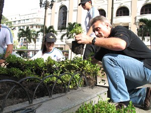 Caravelle Hotel general manager John Gardner (R) and his staff re-plant flowers in the Opera House flower garden on June 4, 2010 (Photo: Tuong Thuy)