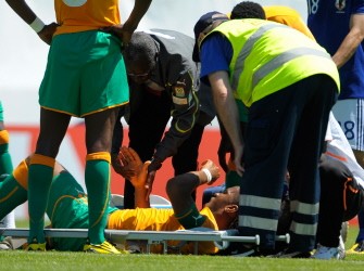 Didier Drogba (down) is seen to by a medic following a collision with Japan's Marcus Tulio Tanaka during a friendly international football match at the Tourbillon stadium in Sion on June 4, 2010. AFP photo