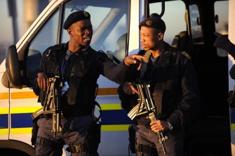 South African special protection unit policemen get ready to take position for the arrival of the Ghanean National Football team on June 07, 2010 at O.R.Tambo International Airport in Johannesburg, South Africa. AFP photo