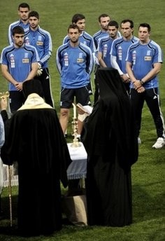 Local Greek Orthodox priests bless Greece's national football team before a training session at the Northwood school in Durban on June 7, 2010. AFP photo