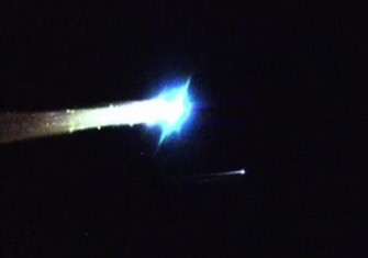 An image grab from video footage released by NASA shows a heat-resistant capsule (right) speeding towards Earth after being ejected from Japan's Hayabusa spacecraft (left). AFP