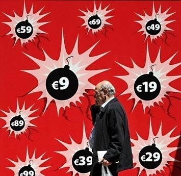 A man passes by a shop window in downtown Athens.(AFP file)