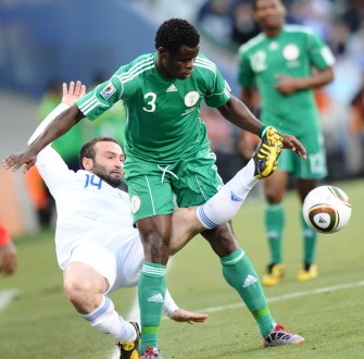 Greece's striker Dimitris Salpingidis (R) fights for the ball with Nigeria's defender Taye Taiwo during the football match Greece vs Nigeria on June 17, 2010. AFP