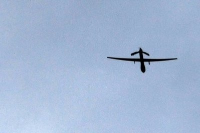 A US 'Predator' drone is seen passing overhead at a forward operating base near Kandahar, Afghanistan. A US drone fired two missiles into a militant compound in Pakistan's northwest tribal belt on Saturday killing at least three rebels, local security officials said