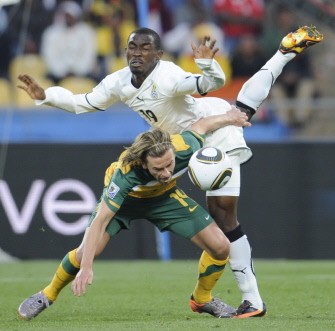 Australia's striker Brett Holman (L) fights for the ball with Ghana's defender Lee Addy during match Ghana vs. Australia on June 19, 2010. AFP