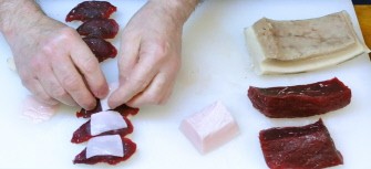 In a picture taken on June 16, 2010 in Japan, sushi shop owner Katsuji Furuuchi makes up whale sushi from sliced minke meats and pieces of blubber in Japanese whaling town Ayukawahama, Miyagi prefecture. Ayukawahama was once a major whaling port. AFP