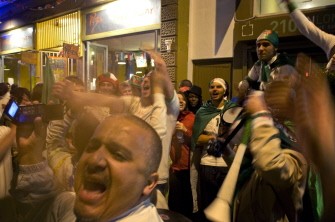 Algerian fans sing, dance, and have a good time in Long Street in Cape Town after England drew 0-0 with Algeria. AFP