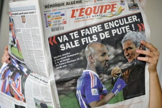 A person reads French sport newspaper L'Equipe on June 19, 2010 in Strasbourg. France striker Nicolas Anelka was kicked out of the World Cup on Saturday after reportedly launching a tirade of abuse at coach Raymond Domenech, according the French Football Federation. AFP