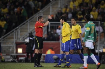 French referee Stephane Lannoy (L) gestures to Brazil's midfielder Kaka (2nd L) as Brazil's midfielder Gilberto Silva (2nd R) and Ivory Coast's striker Didier Drogba (R) look on during the match Ivory Coast versus Brazil on June 20, 2010. AFP
