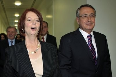 Julia Gillard, left, leaves a Labor Party meeting with Treasurer Wayne Swan in Canberra, Australia, Thursday, June 24, 2010