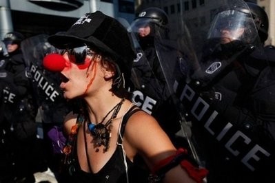 Police hold back demonstrators protesting against the G8/G20 summits in Toronto, Canada. AFP