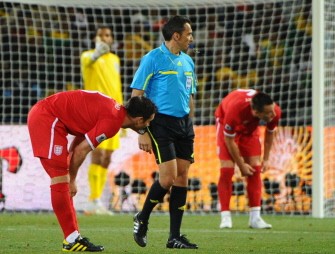Uruguayan referee Jorge Larrionda (C) blows his whistle next to England's midfielder Frank Lampard (L) during the match Germany vs. England on June 27, 2010. AFP