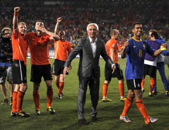 Netherlands' coach Bert Van Marwijk (C) celebrates with Netherlands' players they won the quarter-final Netherlands vs. Brazil on July 2, 2010. AFP