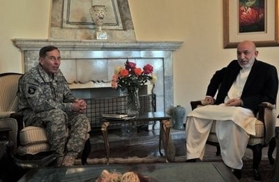 Afghan President Hamid Karzai (R) and commander of NATO forces in Afghanistan, US General David Petraeus, meet at the Presidential Palace in Kabul July 3.