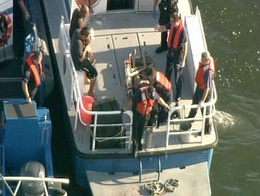 In this July 2, 2010 image taken from video and released by WCBS-TV in New York, rescue teams respond to a fatal boat accident near the Statue of Liberty in New York Harbor.