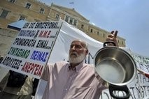 A protestor takes part in a demonstration against pension reforms in Athens. AFP file