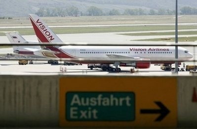 A Vision airlines plane presumed to be carrying 10 men and women who worked as Russian spies in the United States sits on the tarmac at Vienna airport.
