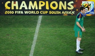 Spain's goalkeeper Iker Casillas stands with his gold medal after winning the 2010 World Cup football final. AFP