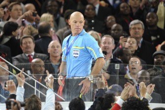 English referee Howard Webb receives his medal at the end of the 2010 World Cup football final. AFP
