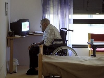 An elderly man watches television in a retirement home in Grenoble, France. AFP file