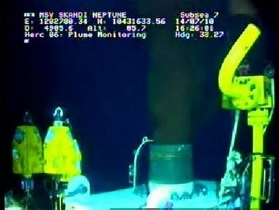 This still image from a live BP video feed shows oil gushing from a leaking BP oil well-pipe after a new sealing cap was installed in the Gulf of Mexico