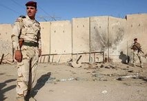 Iraqi soldiers inspect the site of a suicide attack targeting anti-Qaeda militiamen. AFP