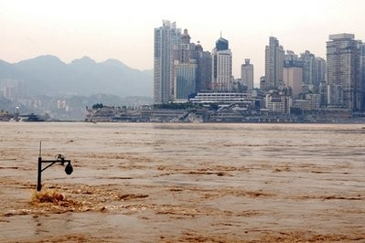 In this Tuesday, July 20, 2010 photo, a street lamp is partially emerged by the flooded Yangtze River in southwest China's Chongqing city.